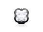 Front view of the lamp face showing the lens and central light source, with the housing and bezel clearly visible.